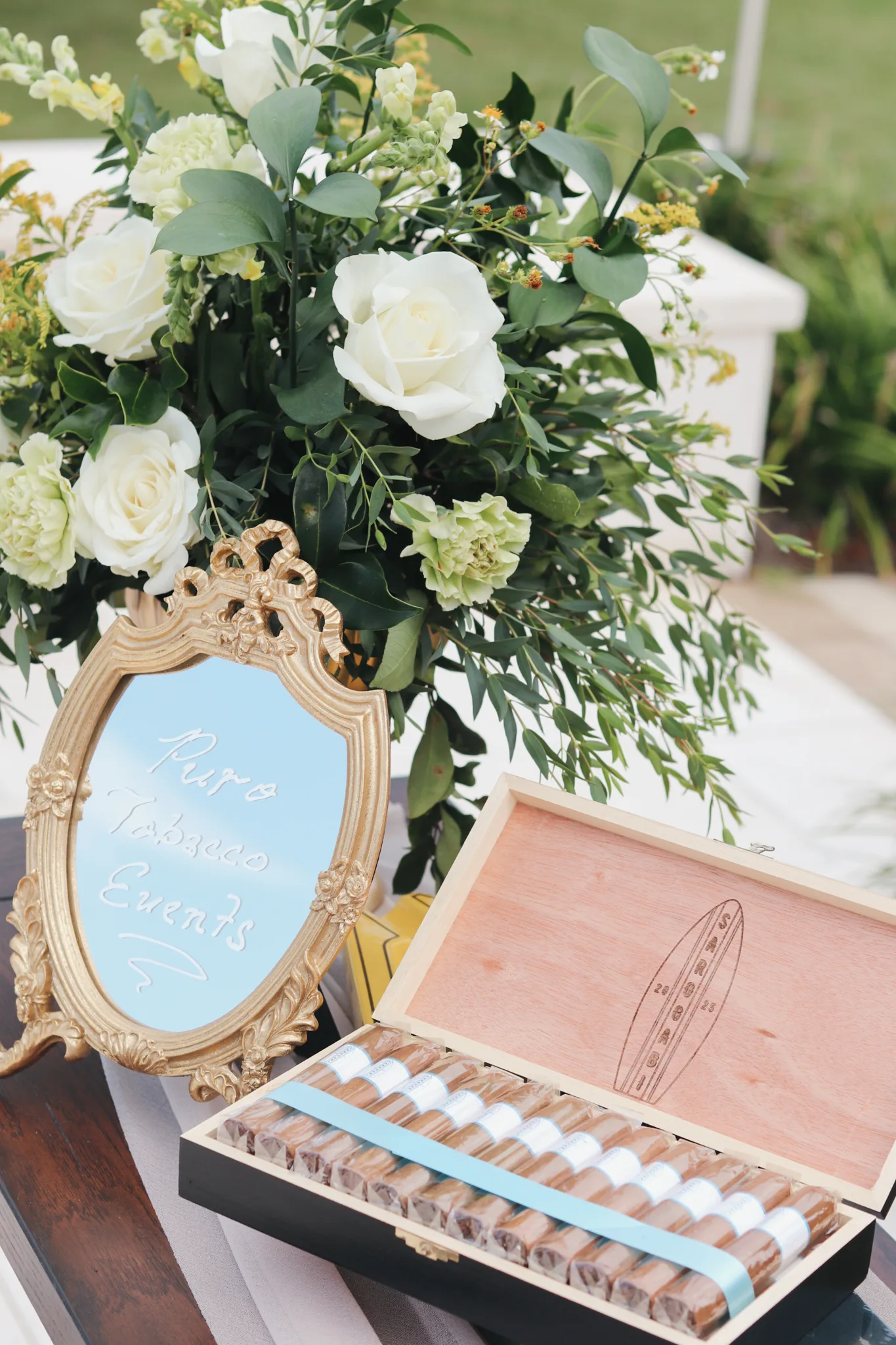 Luxury wedding cigar bar with floral arrangements